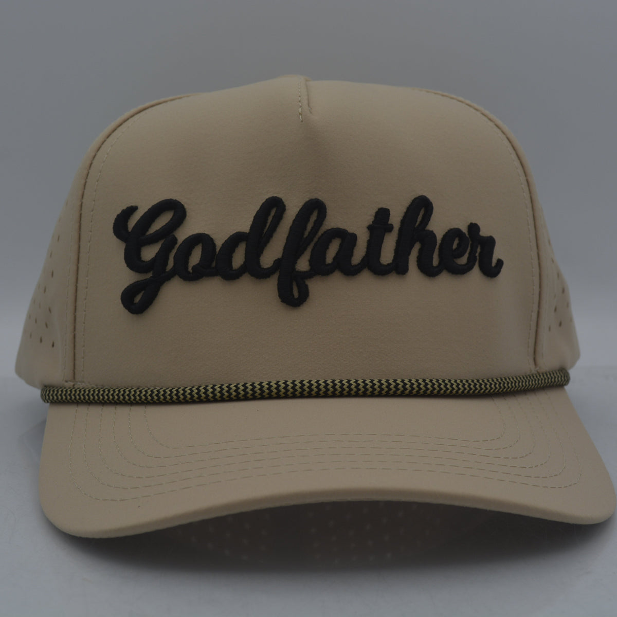 Beige cap with 'Godfather' text on a white background